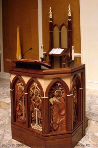 High relief wood carvings of 6 saints by Vonn Hartung, in ambo at St. Paul's Catholic Church, Pensacola, Florida (photo by Steven Schloeder/Liturgical Environs PC)