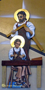 San José in the carpenter shop with Niño Jesús; 2-dimensional illuminated relief (approx 5-ft high) by AVonnHartung at Capilla Divino Niño in Orocovis, Puerto Rico