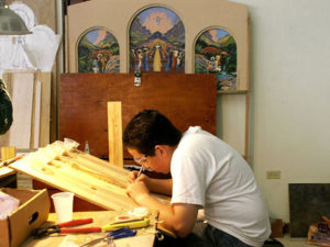 GiovanniDiazJimenez, our first volunteer, cuts tiles for MosicMural in Orocovis. He later became a seminarian studying in Navarra,Spain