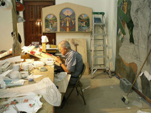 Padre Demetrio Coello, SDB cuts tiles for MosaicMural  in Orocovis, Puerto Rico. He spent many hours working on this project particularly on the figure of St. Peter