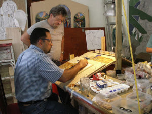 Padre Jorge Santiago Cartagena, SDB cuts tiles for MosaicMural  in Orocovis Puerto Rico