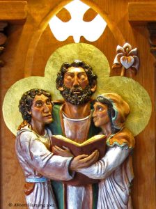 Central detail, Jesus, Mary and Joseph, of Holy Family wood sculpture by A.Vonn Hartung. 
